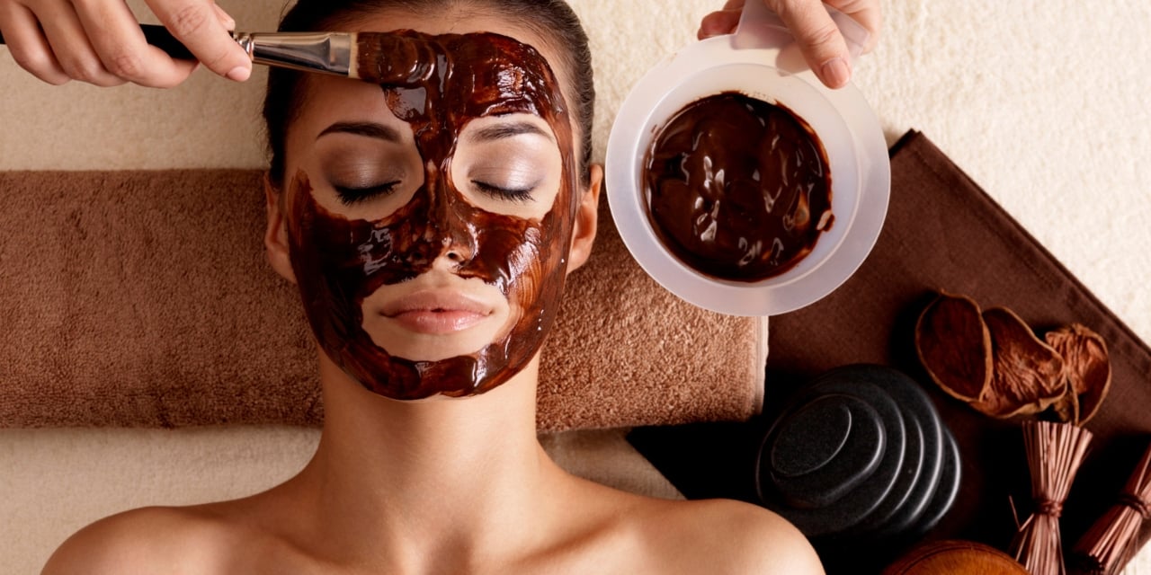 Woman receiving a facial.