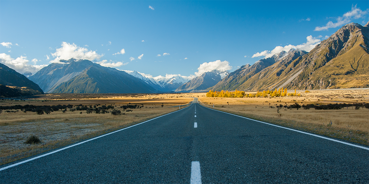 Road through a mountain valley during the day