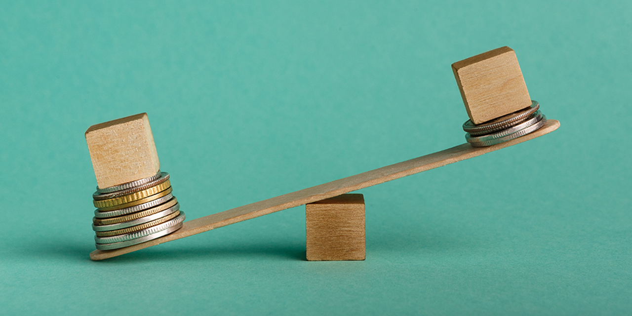 Teeter totter with coins on each end