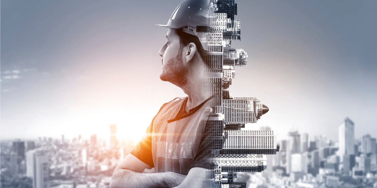 Abstract image of city skylines and a construction worker