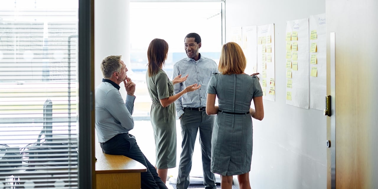 Professionals talking in a meeting.