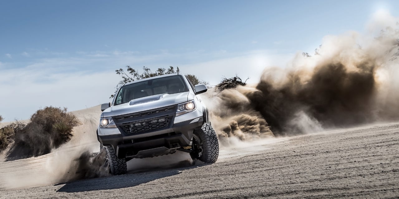 Truck driving on dirt road