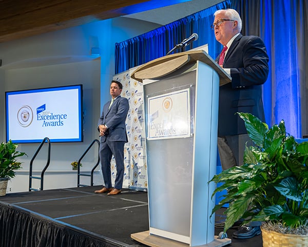 Baird Vice Chair Jim Allen at the podium during the 2024 Baird Excellence Awards event.